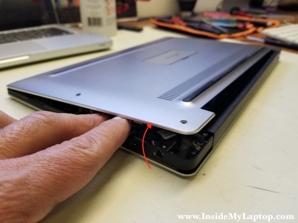 Separate bottom cover from laptop