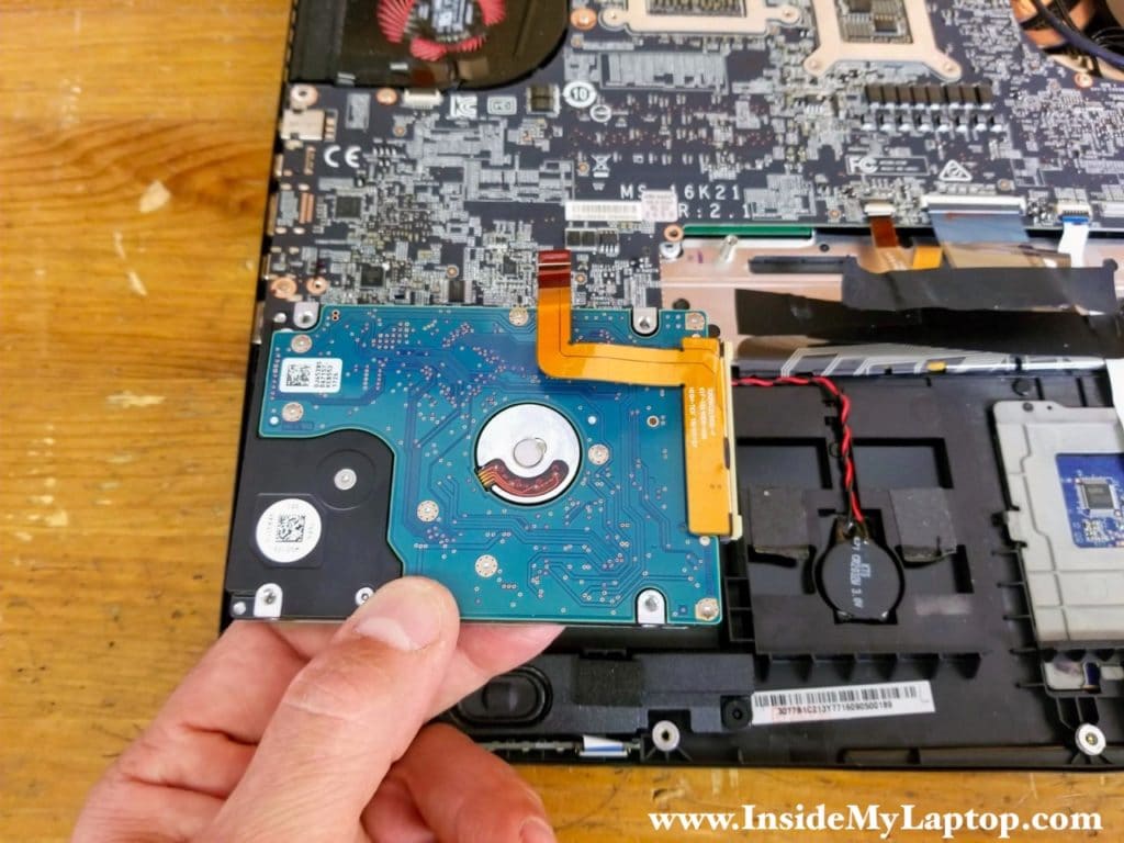 Remove the hard drive with the cable attached to it.