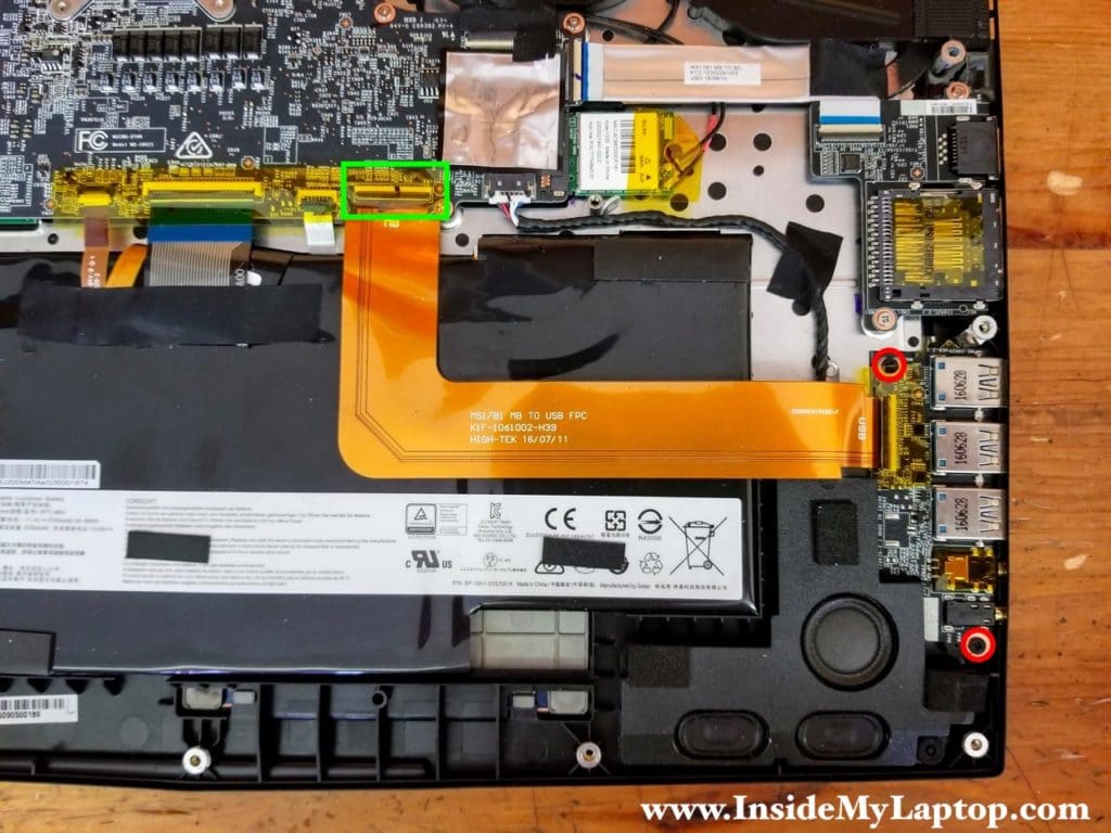 Remove two screws from the USB audio board and disconnect the cable.