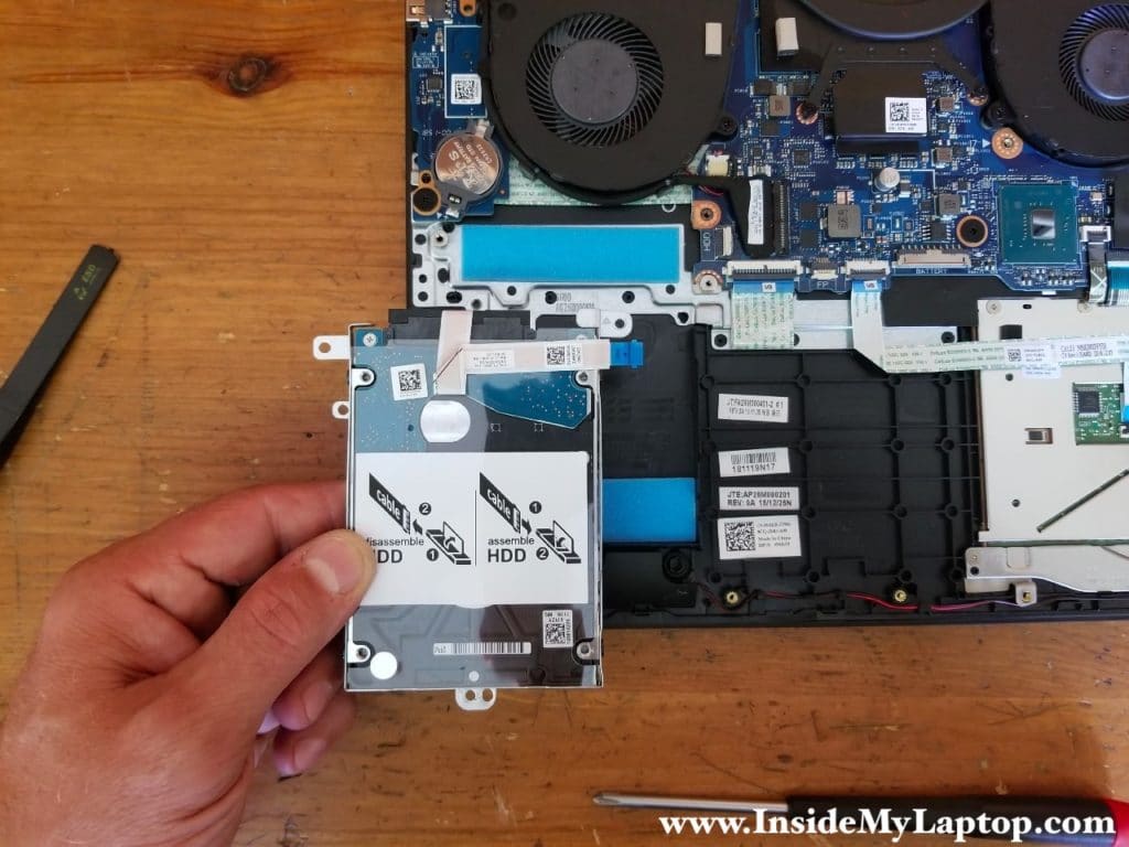 Remove the hard drive assembly with the cable attached.