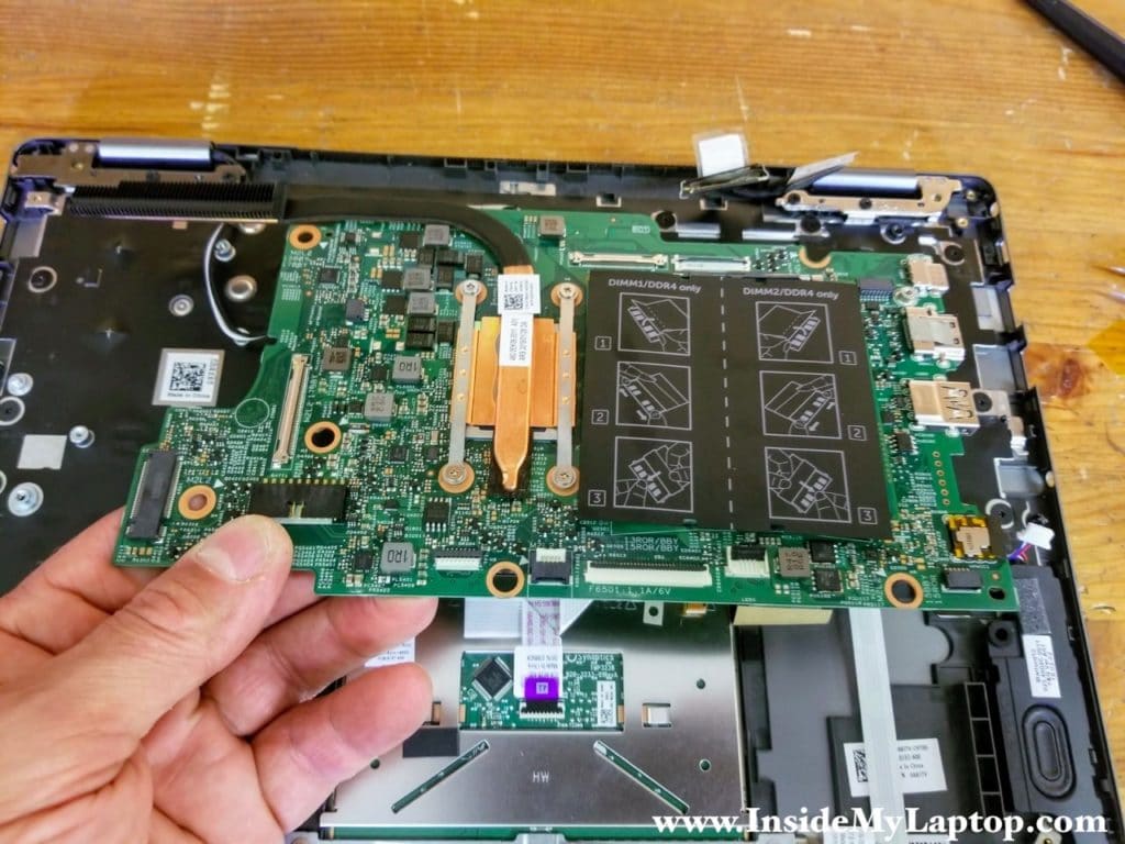 Remove the motherboard from the palmrest assembly.