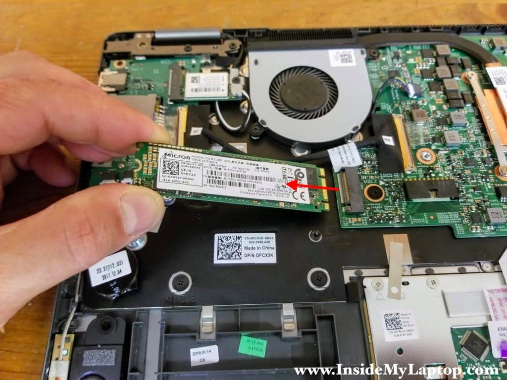 Remove one screw securing the solid state drive. Pull the solid state drive out of the slot.