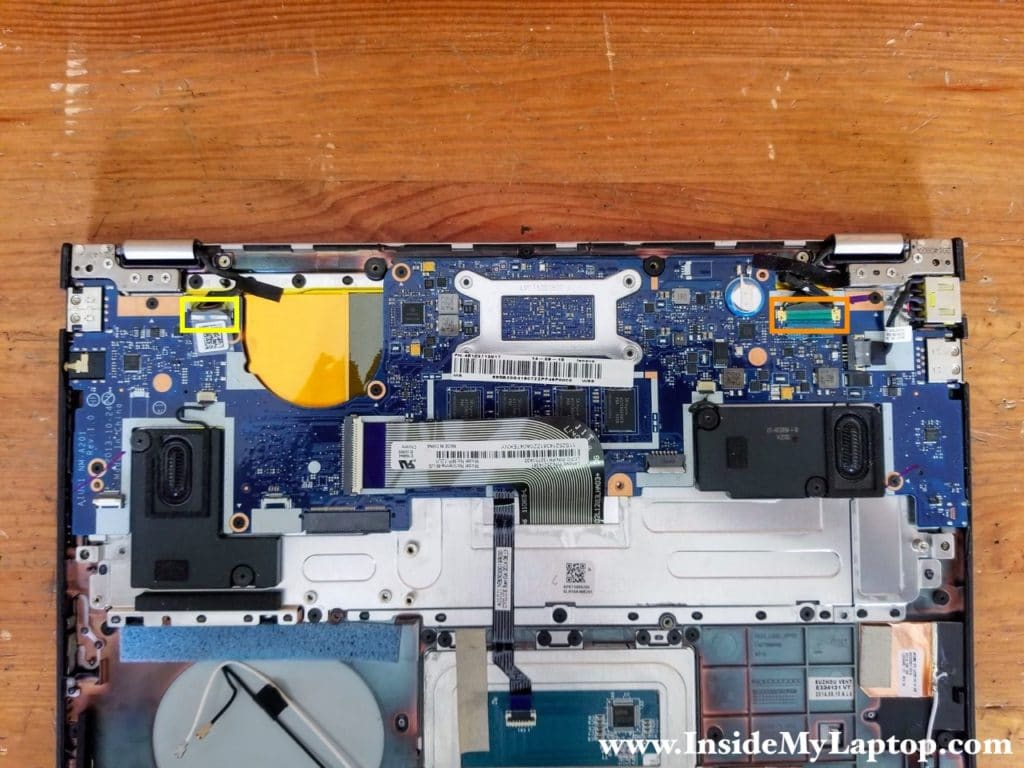 Disconnect the webcam cable (color-coded in yellow) and the display video cable (color-coded in orange).