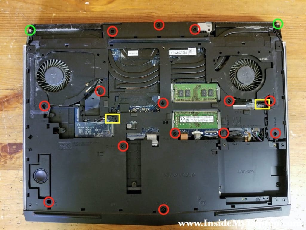 Remove all screws from the computer base and disconnect tron-light cables.