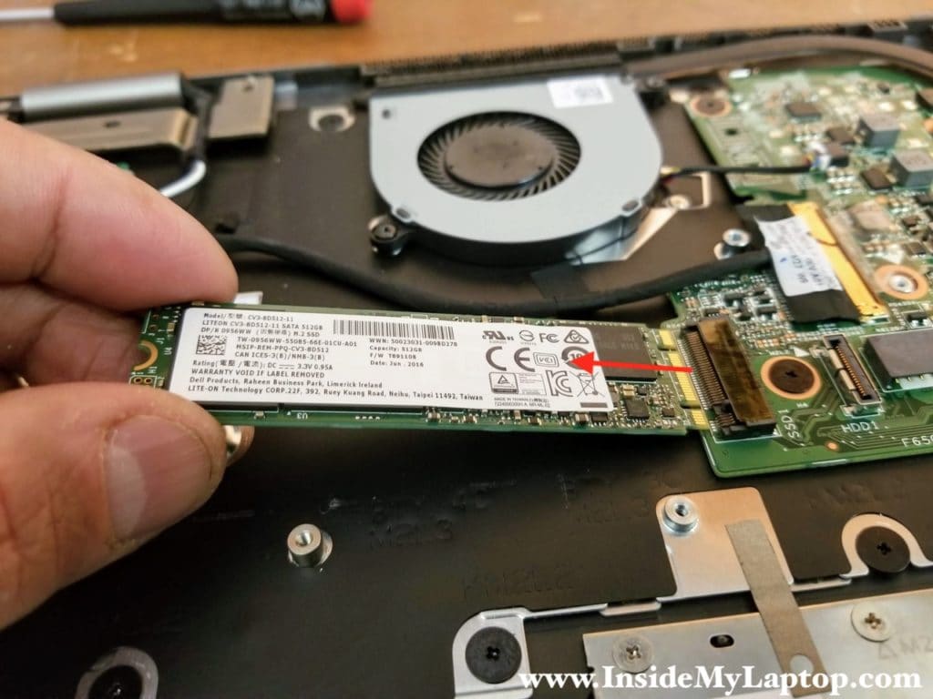 Remove one screw securing the solid state drive. Pull the SSD out.