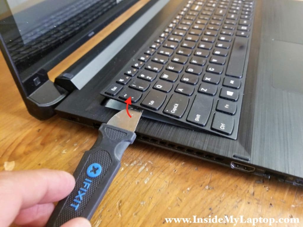 Pry up the keyboard using thin metal case opener tool or other similar tool.