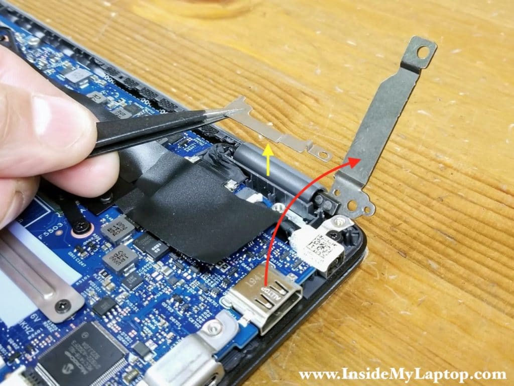 Remove the display cable bracket and lift up the hinge.