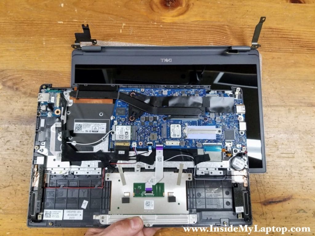 With the display cable disconnected and both hinges lifted up, you can separate the display panel from the top case assembly.