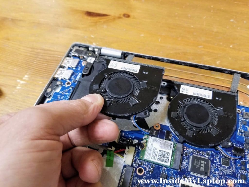 Lift up and remove the first cooling fan.