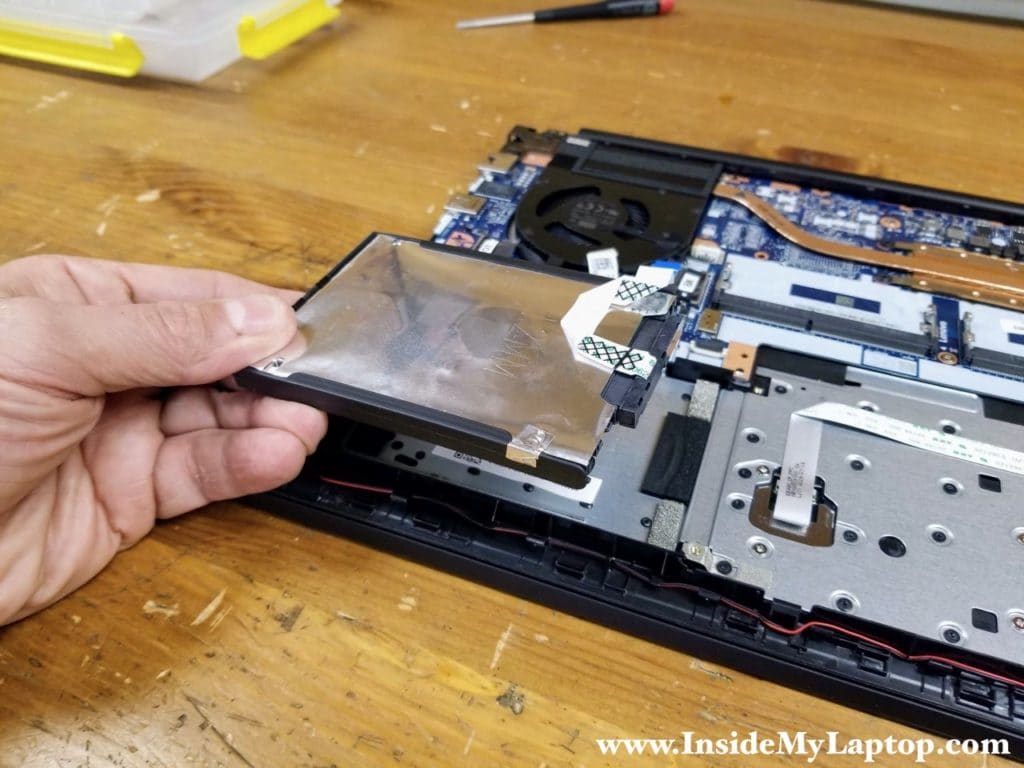 Remove the hard drive with the cable attached to it.