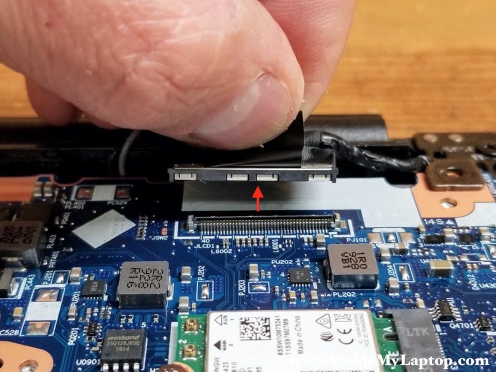 Pull the display cable connector up to unplug it from the motherboard.