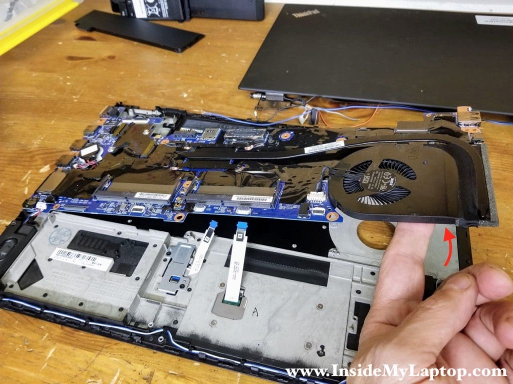 Carefully separate the motherboard from the top case and remove it.