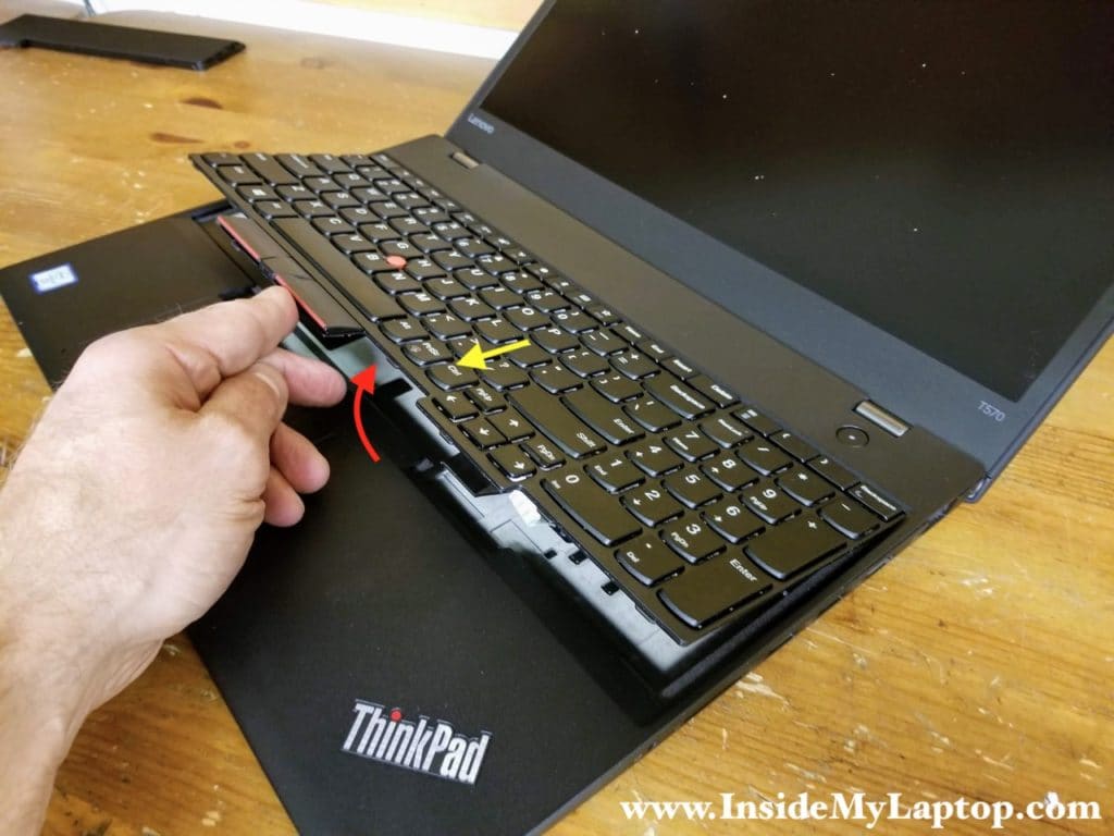 Lift up the lower side of the keyboard and pull it towards the trackpad. Remove the keyboard and turn it upside down on the palmrest.