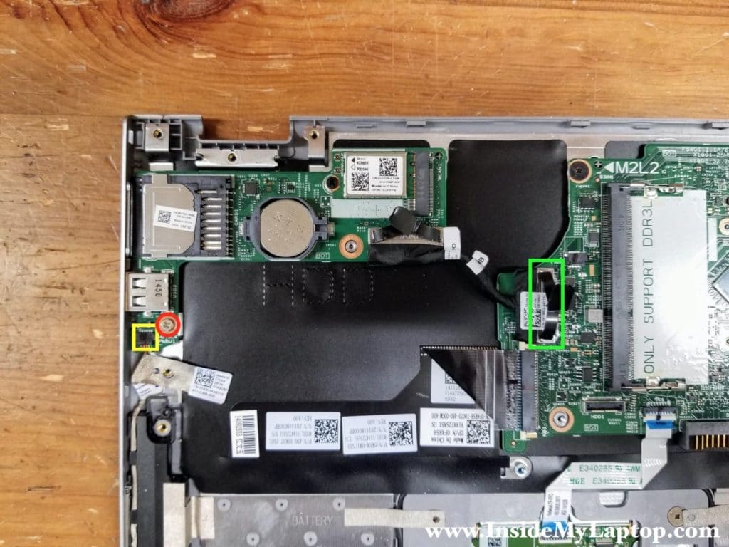 Remove one screw securing the USB/media card reader board and disconnect two cables.