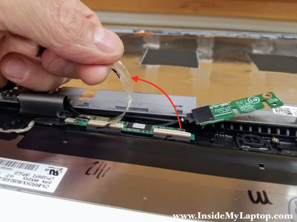 Peel off the clear tape securing the digitizer control board connectors.