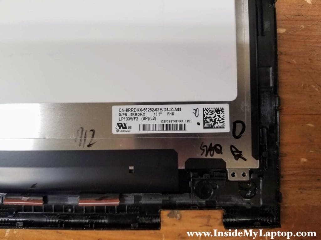 The original Dell part number printed on the back or the original screen.