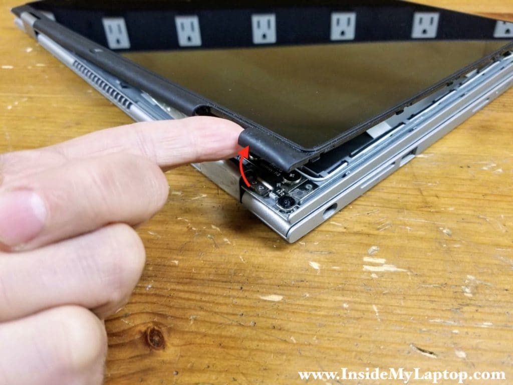 Continue removing the touchscreen assembly around the hinge area.