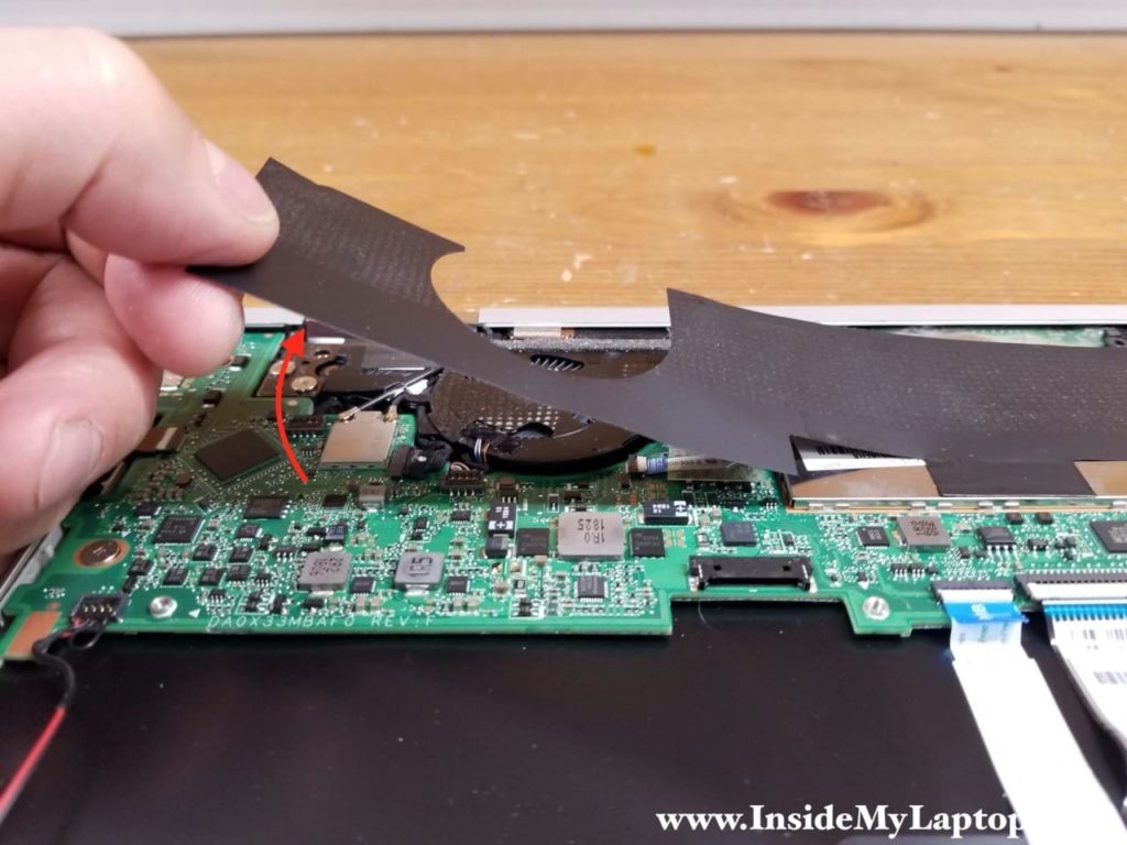 Carefully peel off the mylar sheet from the motherboard.